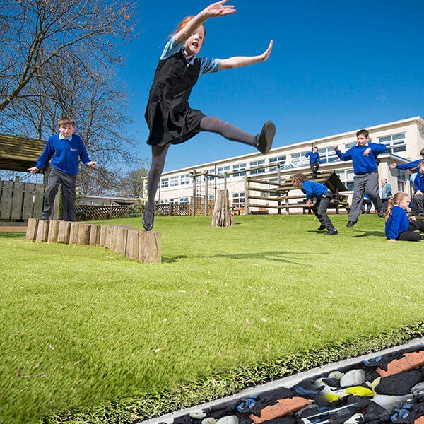 Children playing on the Lazy Pad 25mm shockpad